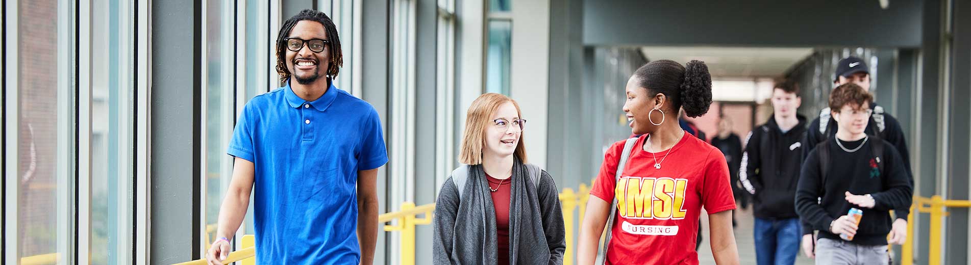 students walking in a hallway of the campus