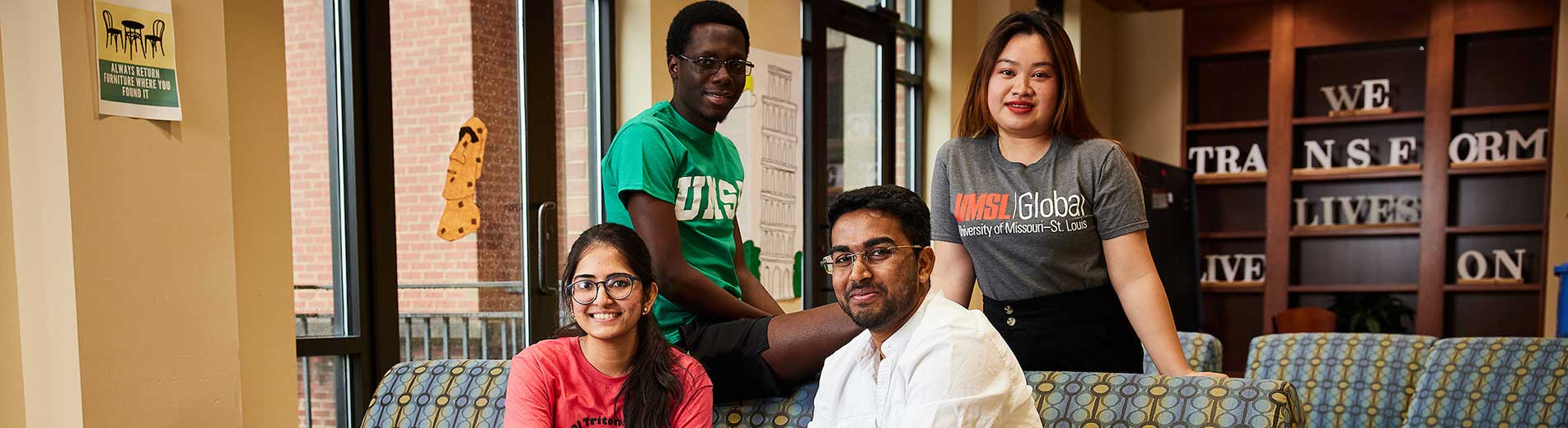 students sitting and smiling