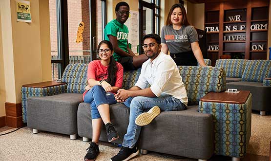 students sitting and smiling