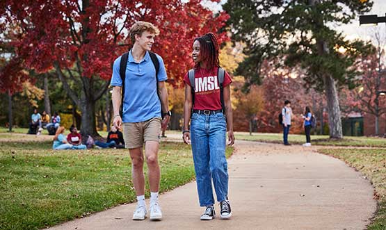 students walking outside on campus